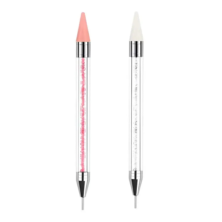 Un paires d'outils à piquer avec des strass, un rose et un transparent, montrés verticalement.
