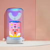A pink and blue electric toothbrush for kids with a glowing light, set against a soft pink background.