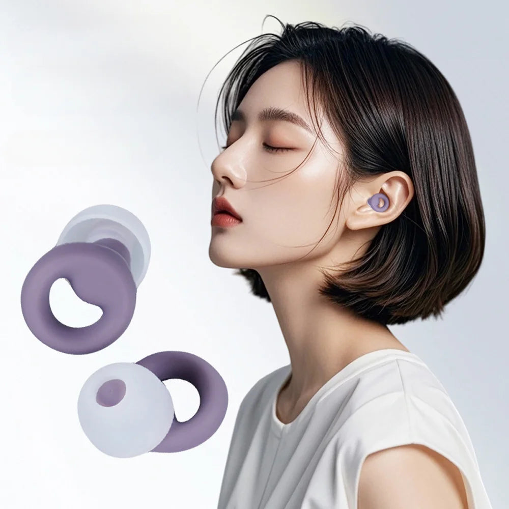 A close-up of a woman wearing a purple silicone earplug, demonstrating noise reduction and comfort.