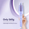 A hand holds a purple professional automatic ceramic curling iron against a light purple background.