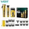 A set of professional electric hair and beard trimmers in gold and black packaging.