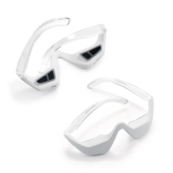 A pair of clear silicone eye masks or beauty massagers for tired eyes
