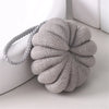 A gray exfoliating bath bubble ball made of soft mesh sponge with a loop for hanging.
