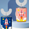 A pink and blue automatic electric toothbrush for kids with clear silicone brush heads displayed on a light blue surface.