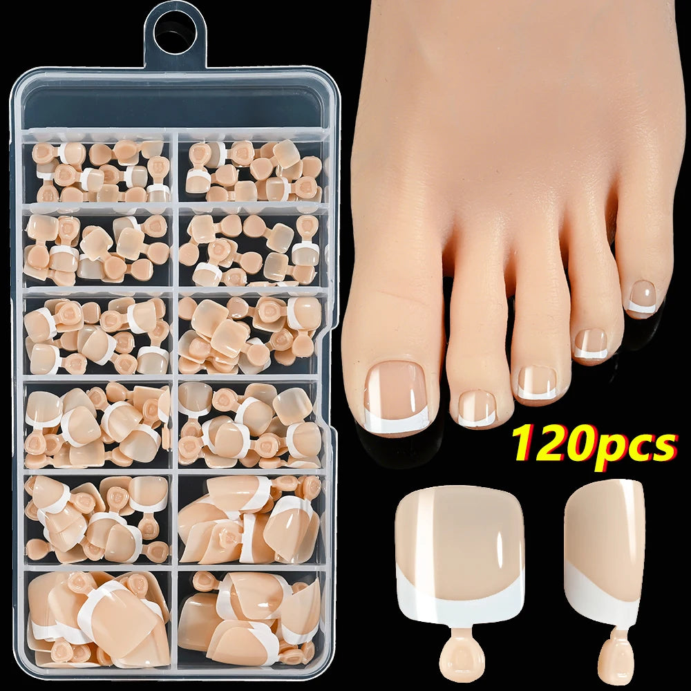 Un recipiente de plástico transparente contiene 120 prensas francesas beige y blancas para arte en uñas.