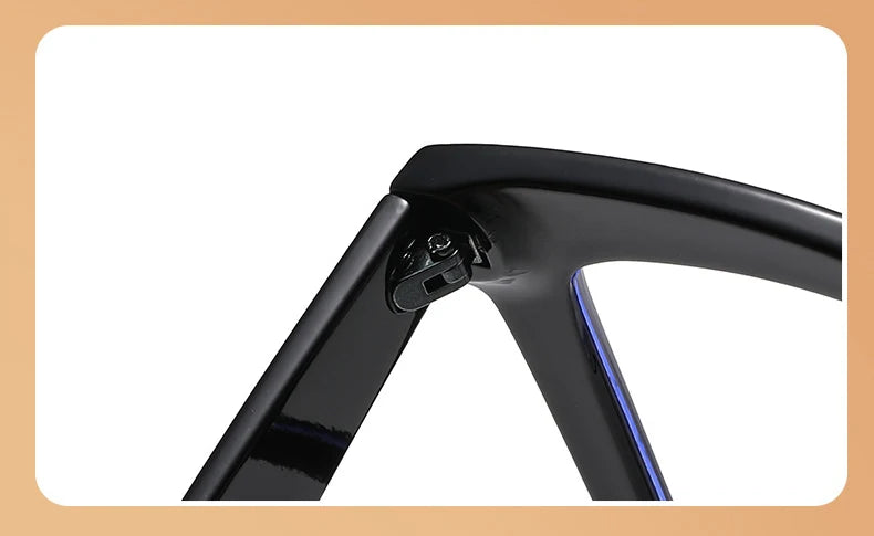 A close-up view of black square frame reading glasses with blue light protection.