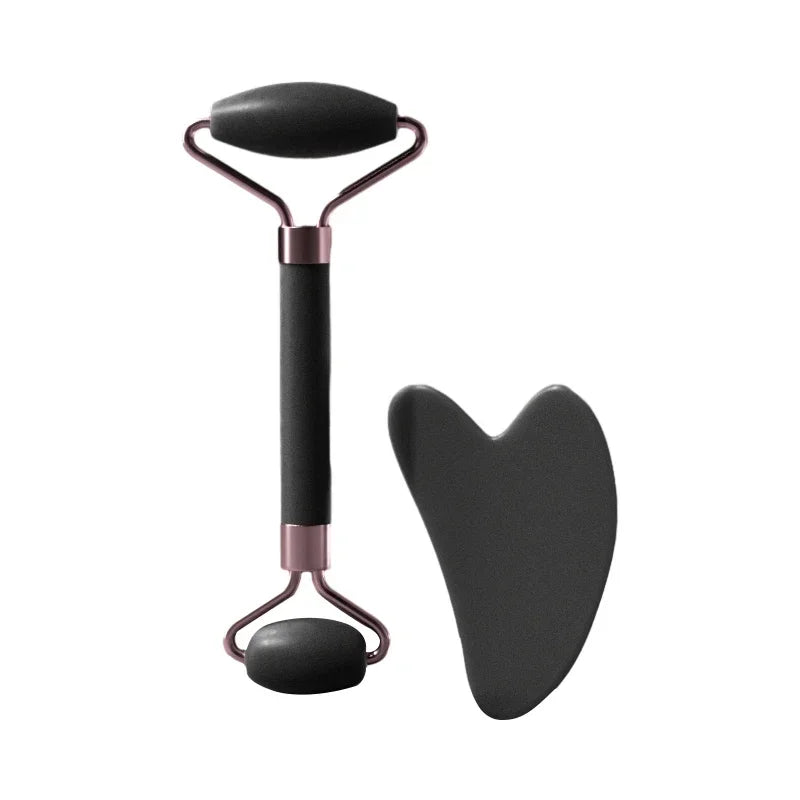 A jade gua sha facial stone set consisting of a metal tool and a black stone.