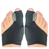 A pair of black orthopedic toe separator and bunion corrector pads shown on human feet.