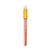 A clear bottle with a gold cap and an applicator brush filled with orange-colored eyelash extensions.