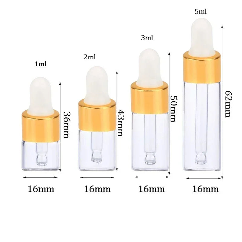 A set of ten glass dropper bottles with gold caps and various volume markings for essential oils and samples.