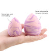 A pink makeup sponge puff demonstrating normal size and larger volume after water intrusion.