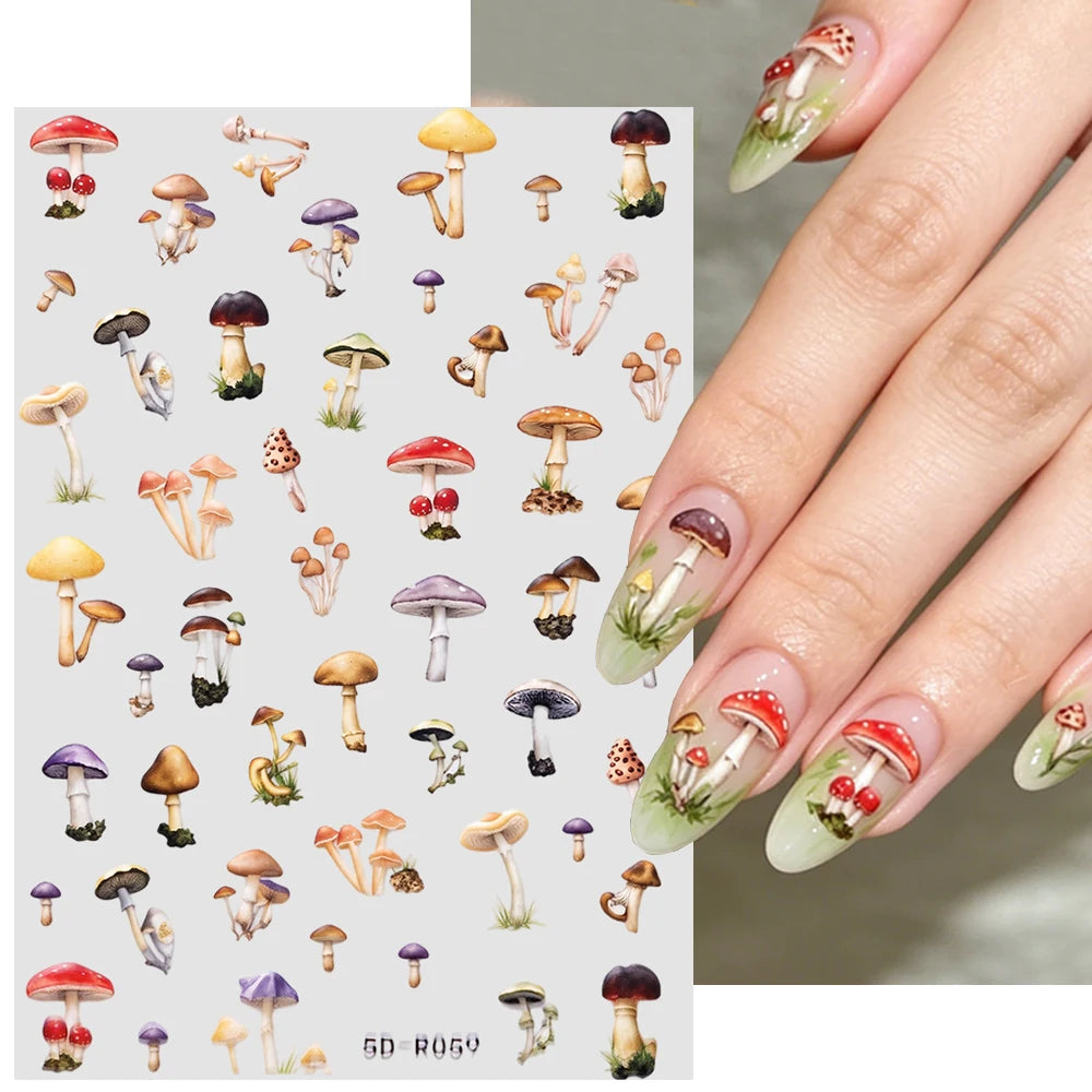 Close-up of a hand displaying long nails decorated with watercolor mushroom nail art stickers.