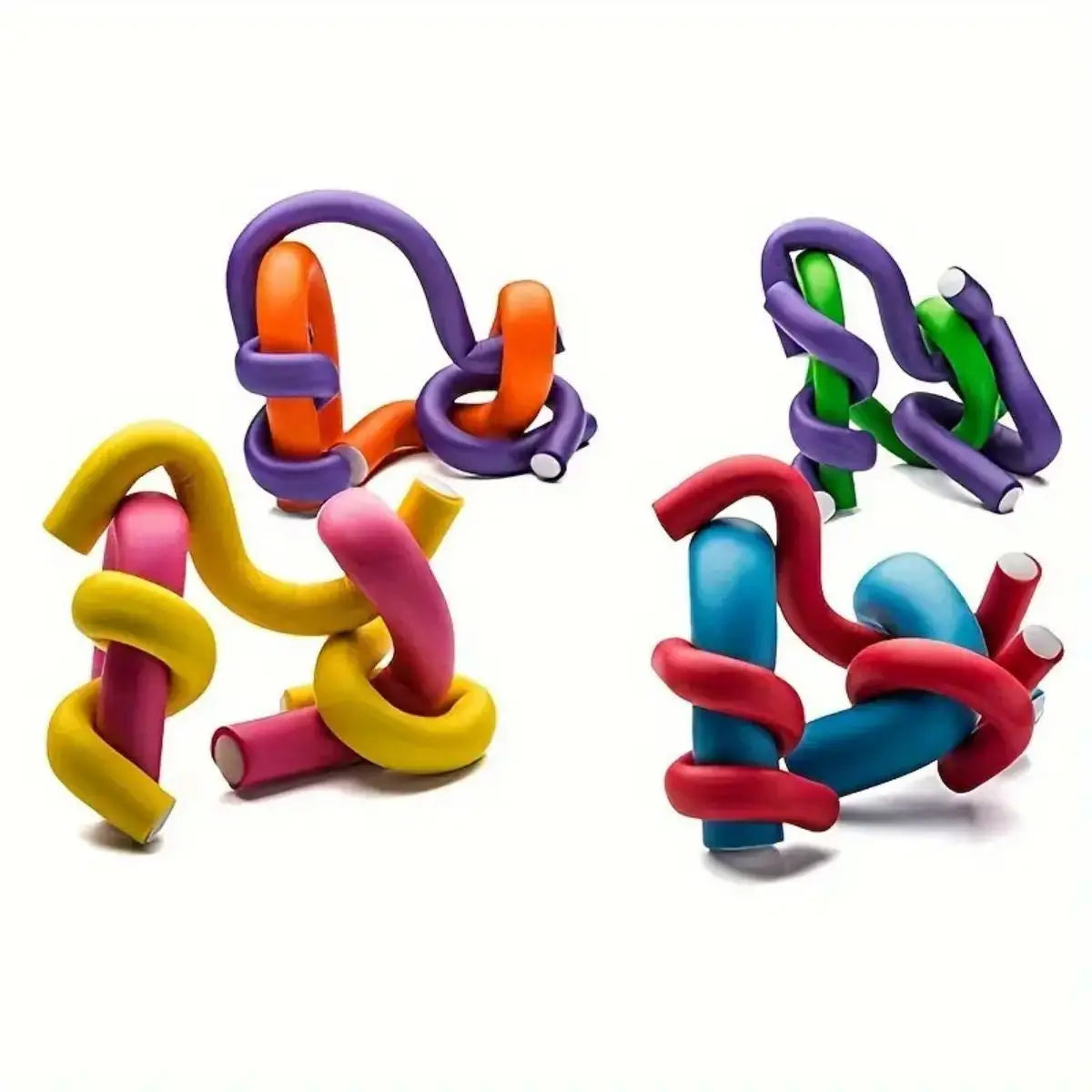 A collection of colorful soft foam heatless hair rollers in purple, orange, green, and yellow.