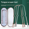 A set of stainless steel and copper tongue scrapers for oral hygiene displayed on a white surface.