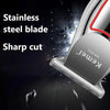 Close-up of a silver Kemei electric hair trimmer with a stainless steel blade demonstrating a sharp cut.