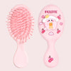 A pink cartoon mini air cushion massage comb with a yellow handle and fruit decorations.