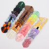 A set of 12 air cushion beauty puffs in various shades of green, brown, and pink arranged diagonally.