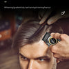 A close-up of a man getting a haircut with electric clippers, showing the process of creating a stylish look.