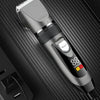 A silver electric hair clipper with a guard is shown against a dark background.