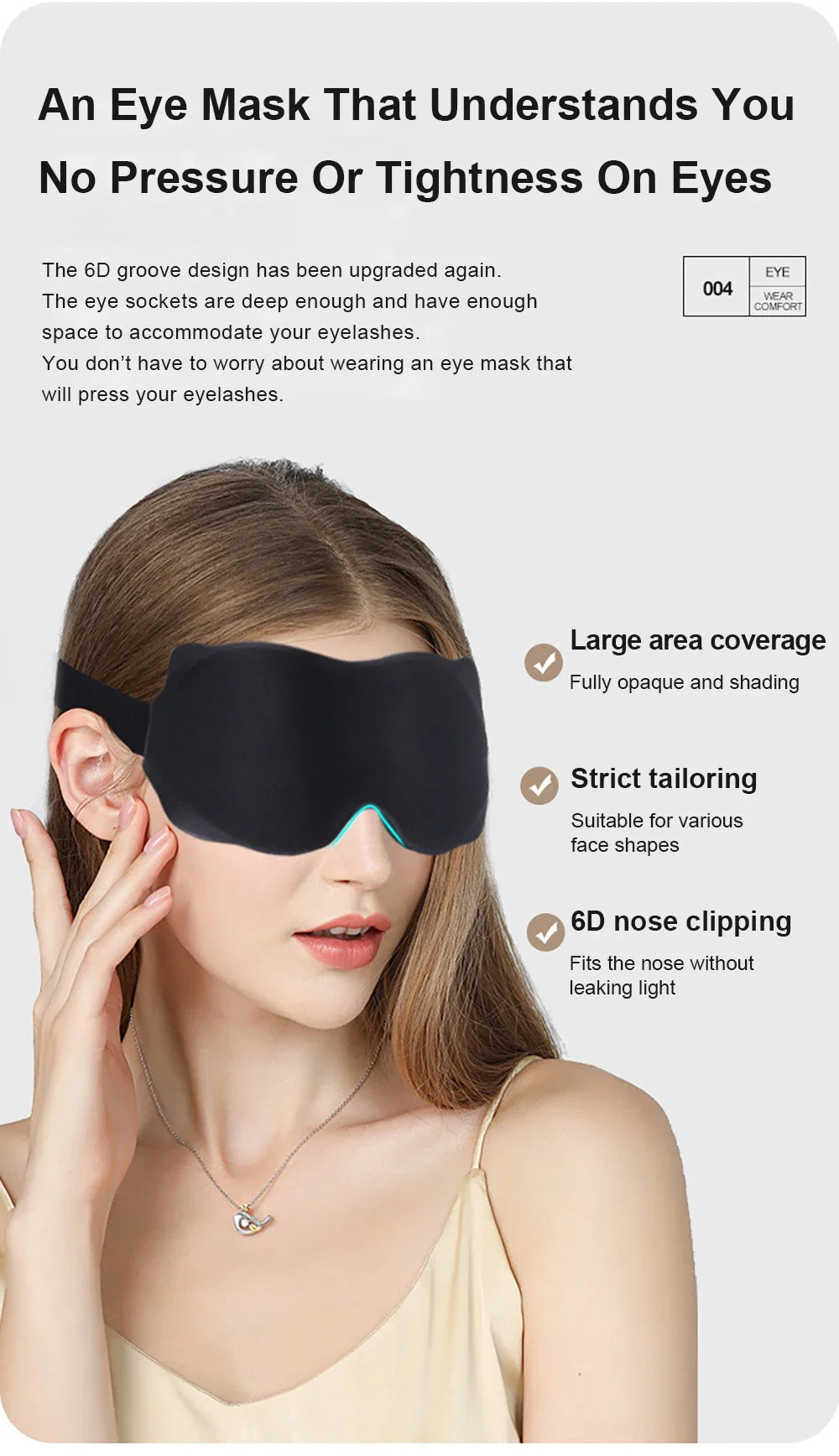 A woman is wearing a black eye mask with blue accents, demonstrating its large coverage and tailoring features.