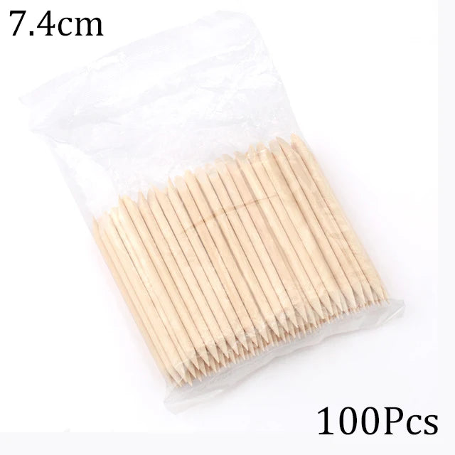 A package containing 100 natural wood nail art pusher sticks, measuring 7.4cm long.