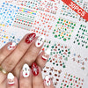 A hand displays Christmas Santa Claus 3D nail art stickers with glitter designs on a white background.