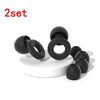 A set of two black silicone ear plugs for sleep and protection displayed on a white surface.