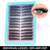 A plastic tray of individual black lash clusters for DIY eyelash extensions, showing various lash styles and a close-up of an