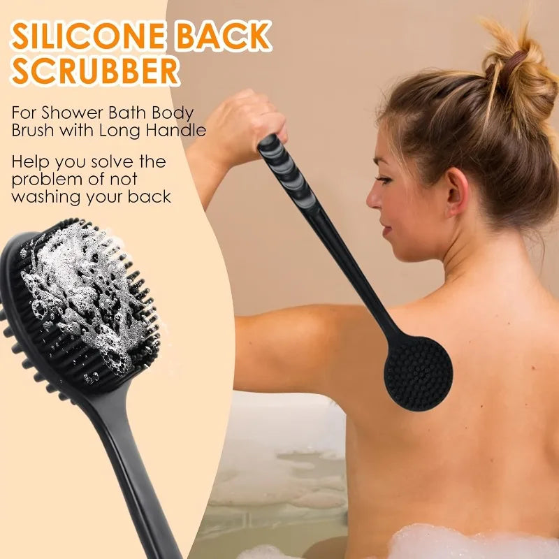 A woman is using a silicone back scrubber brush on her back in a bathtub setting.