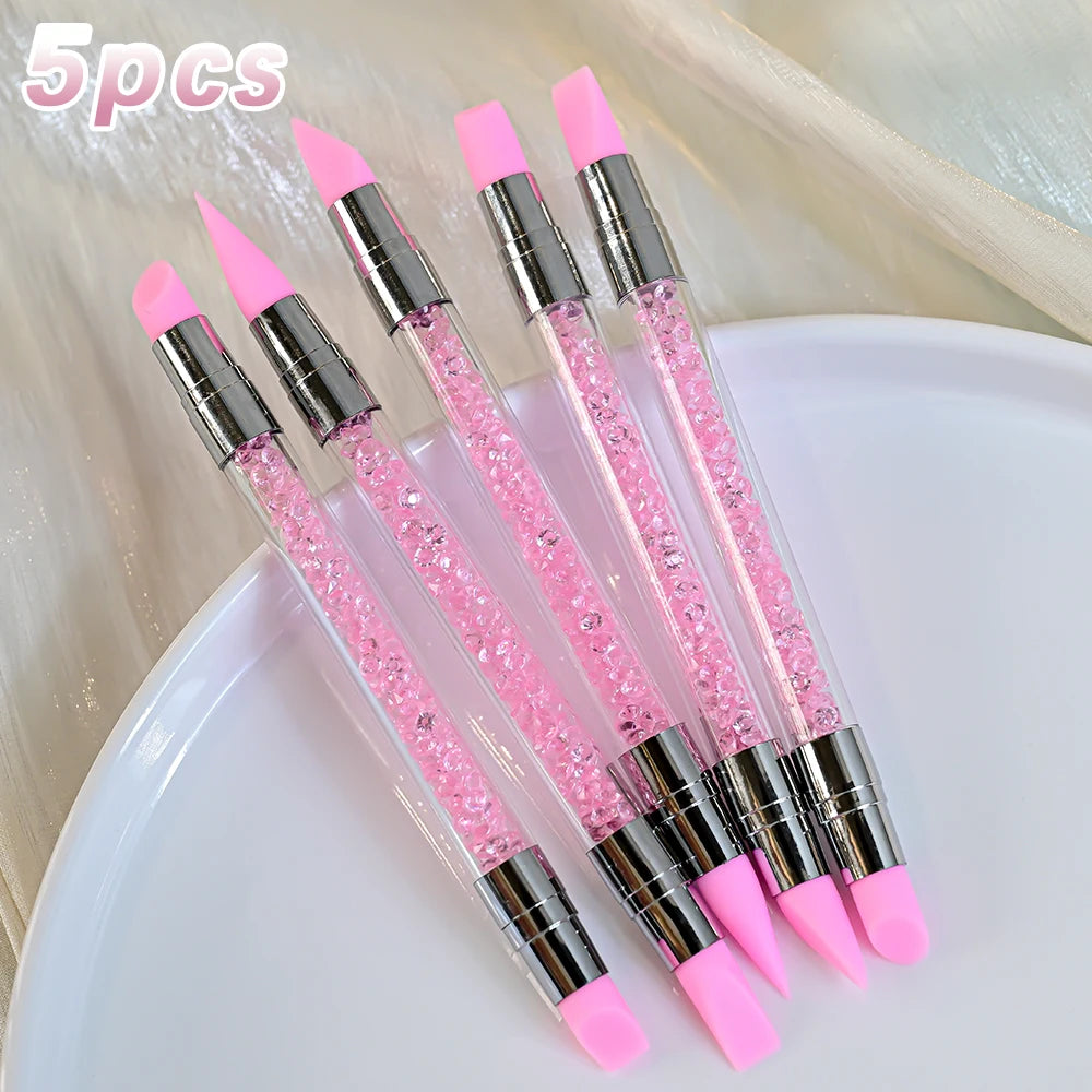 A set of five pink nail art liner brushes with ultra-fine tips displayed on a white surface.