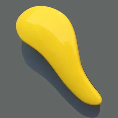 A bright yellow classic detangling hair brush is shown in a side profile against a gray background.