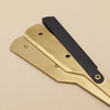 A professional stainless steel shaver and beard razor kit with gold and black components.