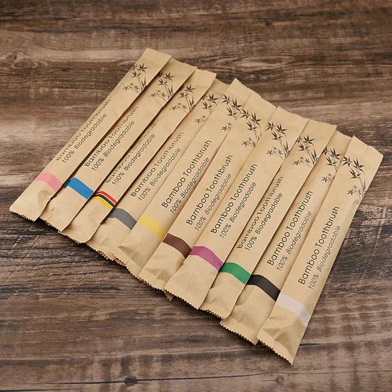 A fan of eco-friendly bamboo toothbrushes packaged in individual cardboard sleeves.