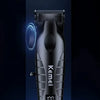 A black Kemel electric hair and beard trimmer is displayed on a blue illuminated platform.