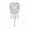 A decorative pearl hand mirror with a white ribbon bow for makeup and beauty.