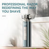 A sleek, metallic electric razor with a magnetic detachable head is displayed on a wooden surface.