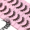 A pink tray of wispy cat eye false mink eyelashes is shown in a close-up view.