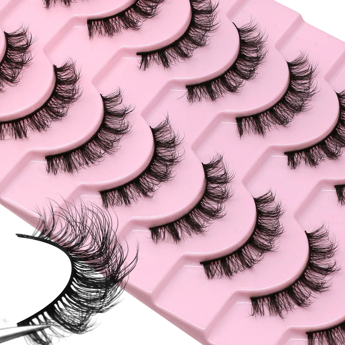 A pink tray of wispy cat eye false mink eyelashes is shown in a close-up view.