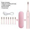 Pink sonic electric toothbrush set including body, USB charging cable, brush heads, and travel box.