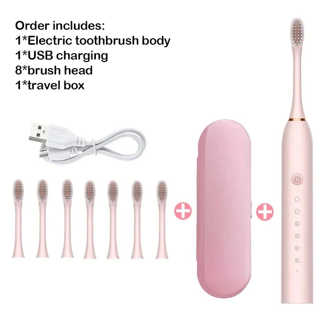 A pink electric toothbrush set including the body, USB charging cable, brush heads, and a travel box.