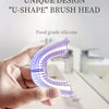 A hand holds a purple U-shaped silicone brush head for an ultrasonic electric toothbrush.