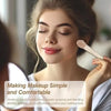 A woman applies makeup using a professional makeup brush set on her face.