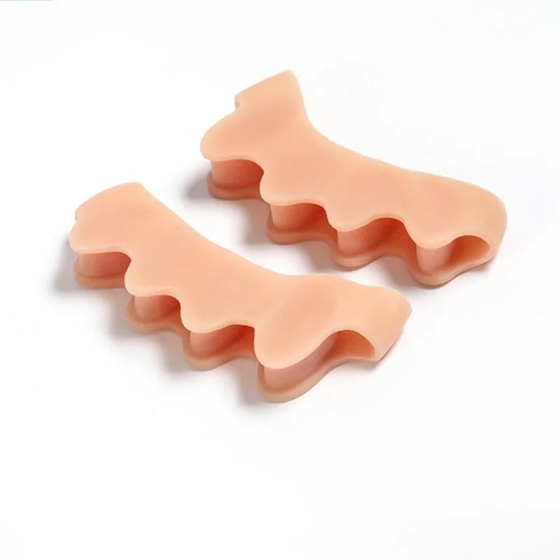 A pair of pink silicone toe separators designed for foot and bunion relief.