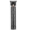A black professional wireless beard shaver trimmer with a gold-colored shaving head.