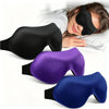 Un ensemble de trois masques de sommeil ajustables noirs, violets et bleus posés sur une surface blanche.