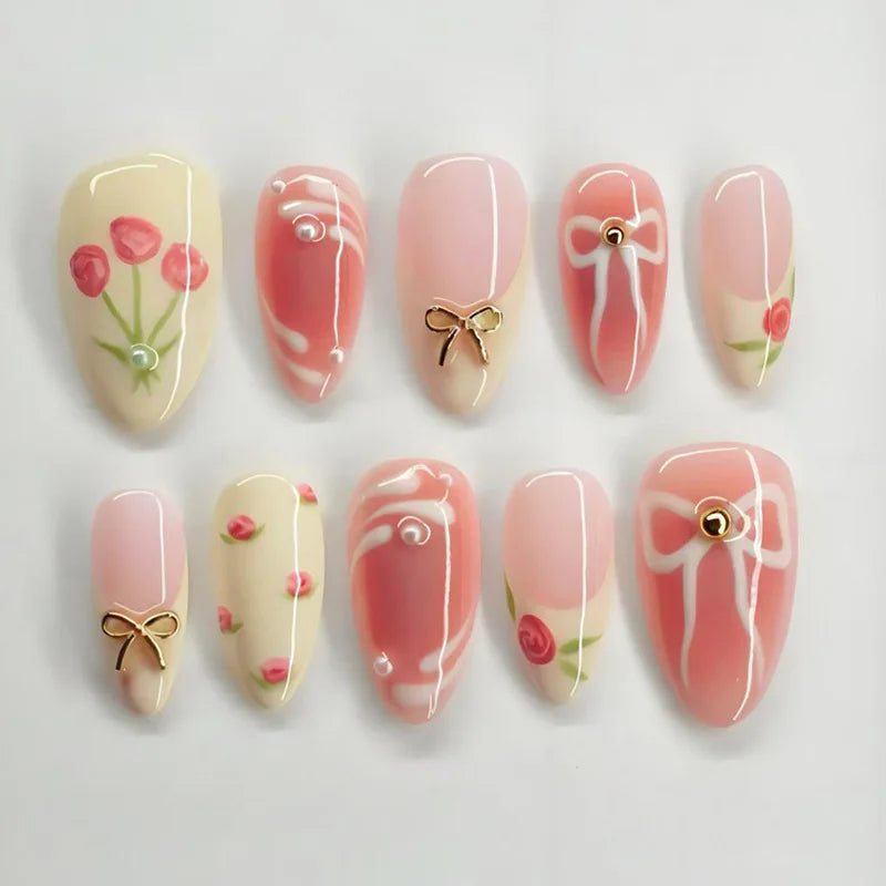 A set of 24 pink heart pearl press-on fake nails featuring a glossy finish and floral accents.