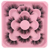 A pink plastic tray holding a set of black artificial mink eyelashes