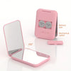 A pink mini folding makeup mirror with an LED light and a mechanical switch shown open and closed.