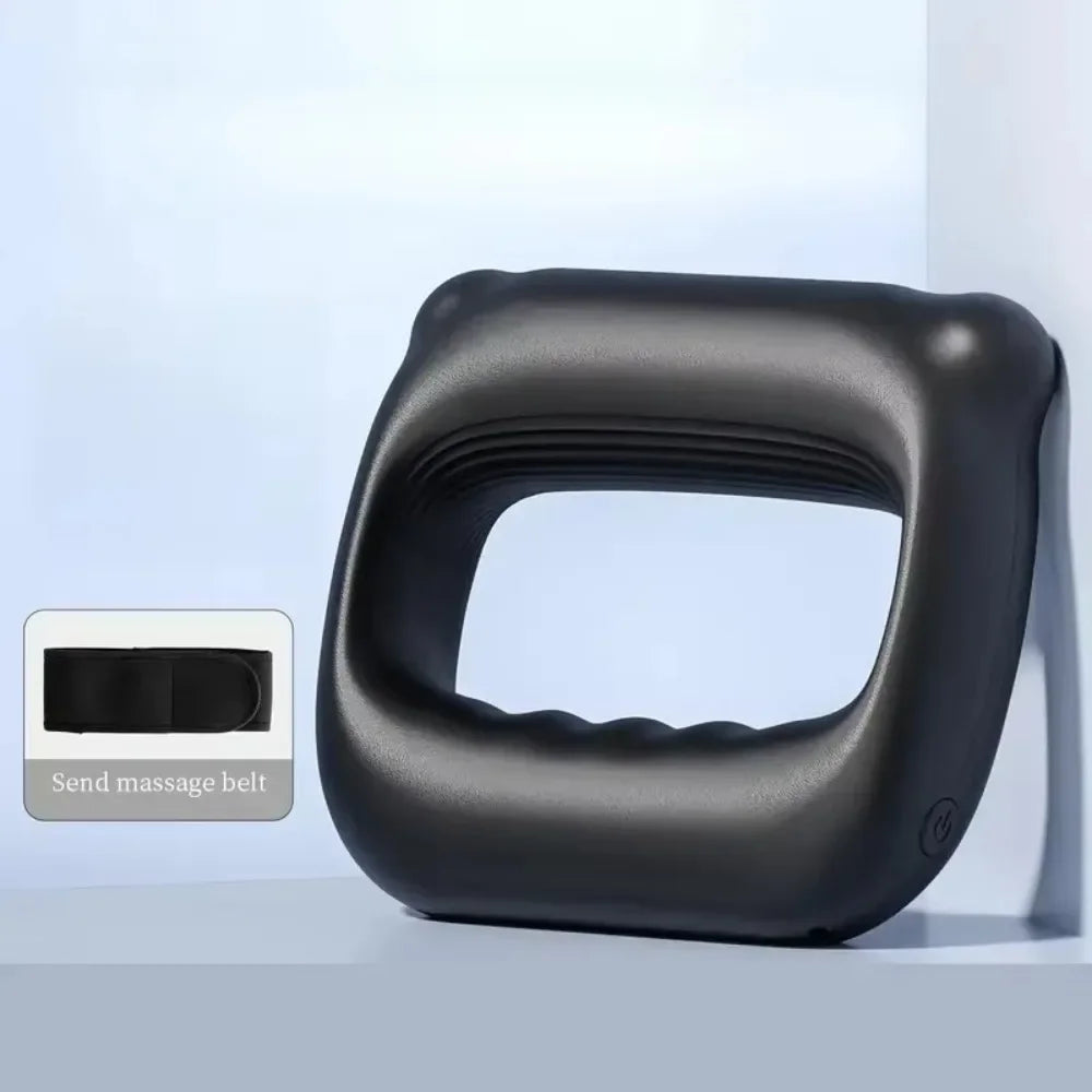 A black portable electric fascia massager belt lying on a light surface.