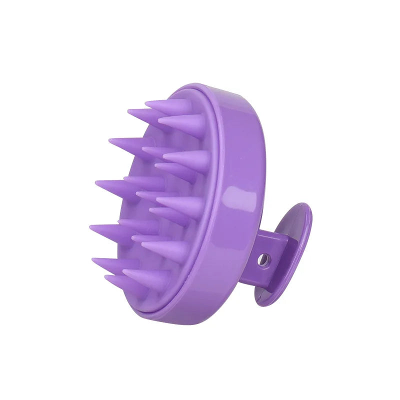 A purple silicone scalp massage and body brush with numerous pointed bristles.